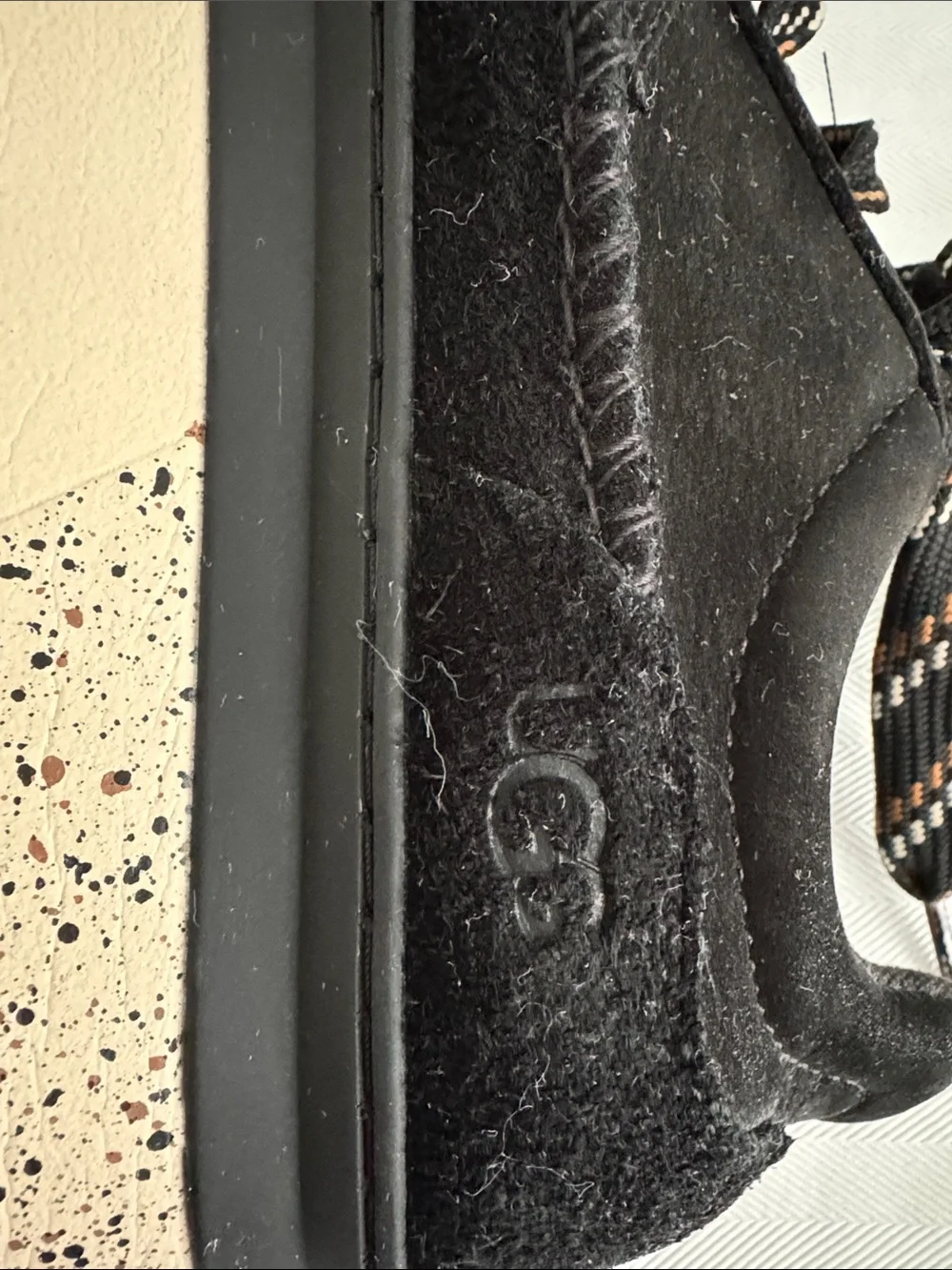 UGG women’s Black Suede Sneakers with Patterned Laces